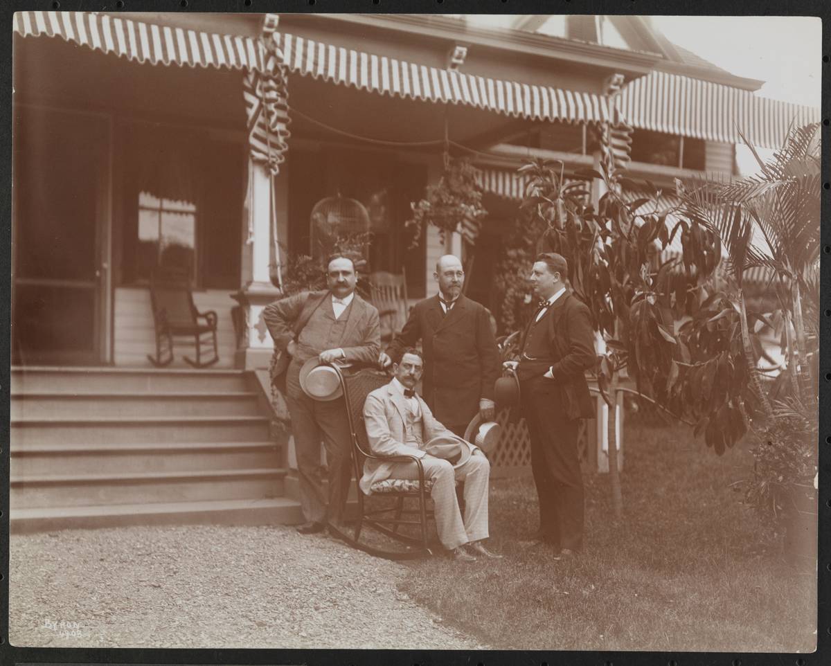 A group of horsemen pose together for a photo in 1898.