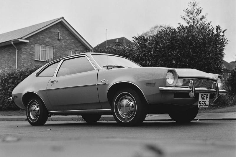 Ford Pinto parked on the side of a road