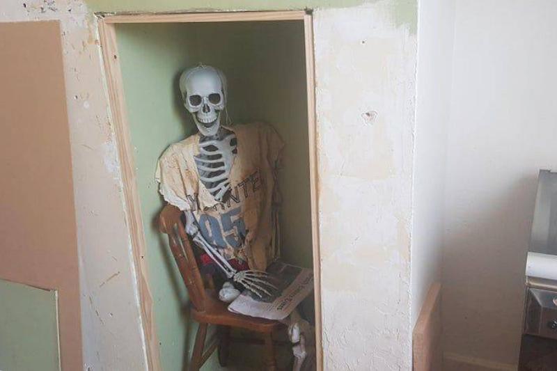 skeleton in wall