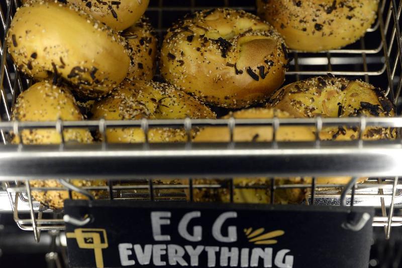 Egg everything bagels are for sale at a bakery.