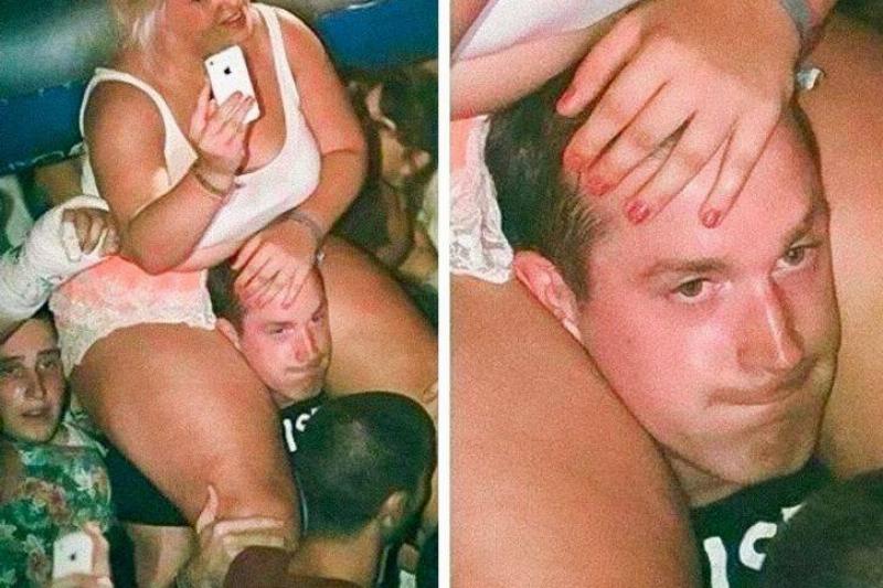 man struggling while giving a woman a piggyback ride at a concert