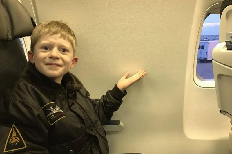 kid pointing to lack of window with a grimace