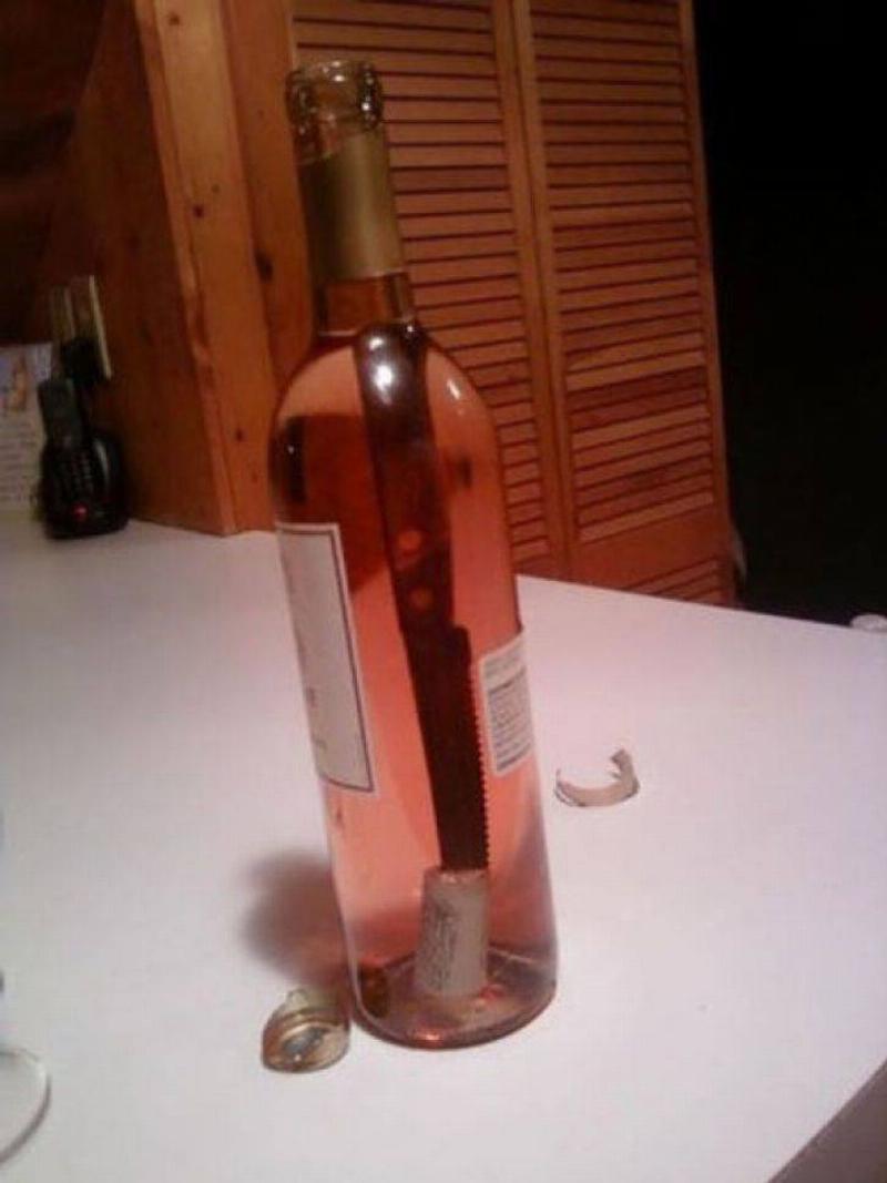 Knife inside wine bottle 