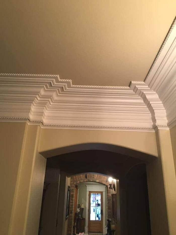 Over 20 layers of crown moulding above a door