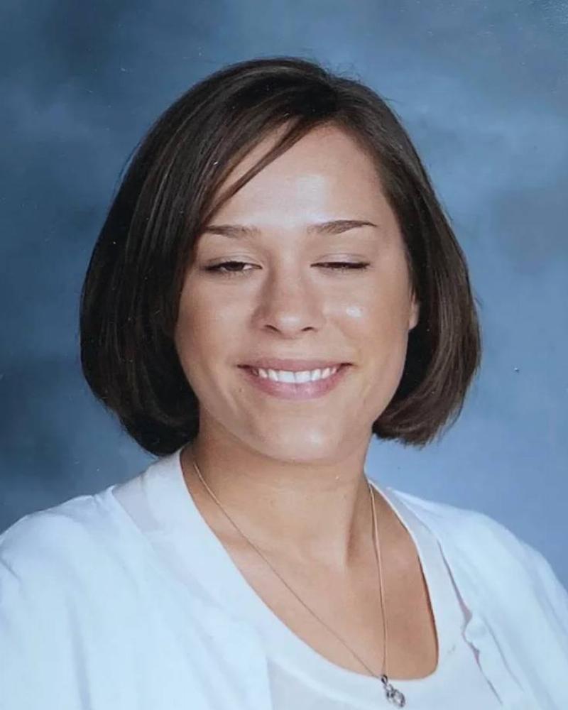 Woman is making weird face in school teacher photo