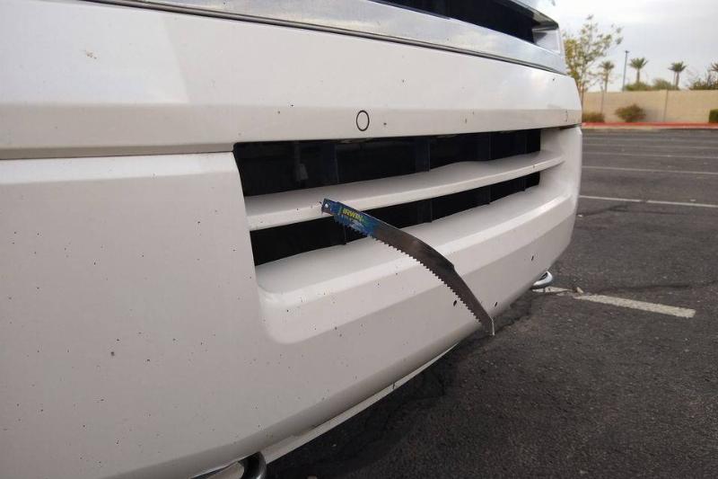 saw part sticking out of car