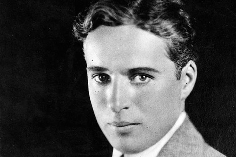 charlie chaplin in a black and white portrait