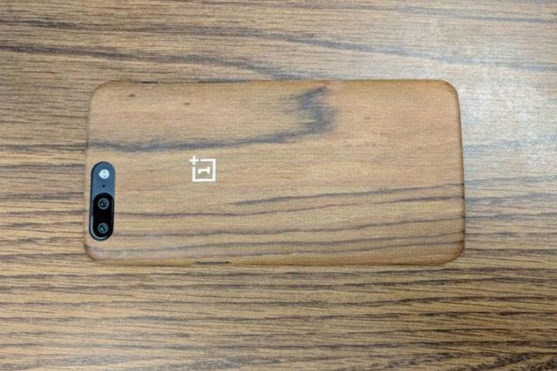 phone on wood surface in wood-style phone case