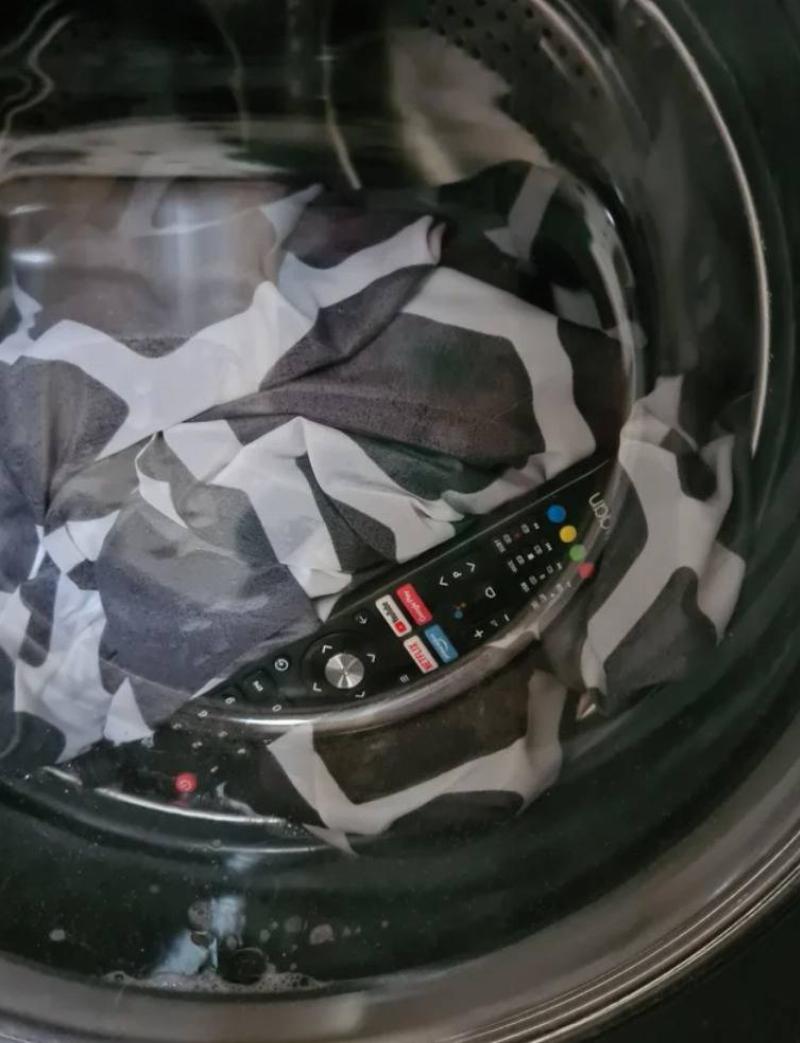 television remote with clothes inside washing machine
