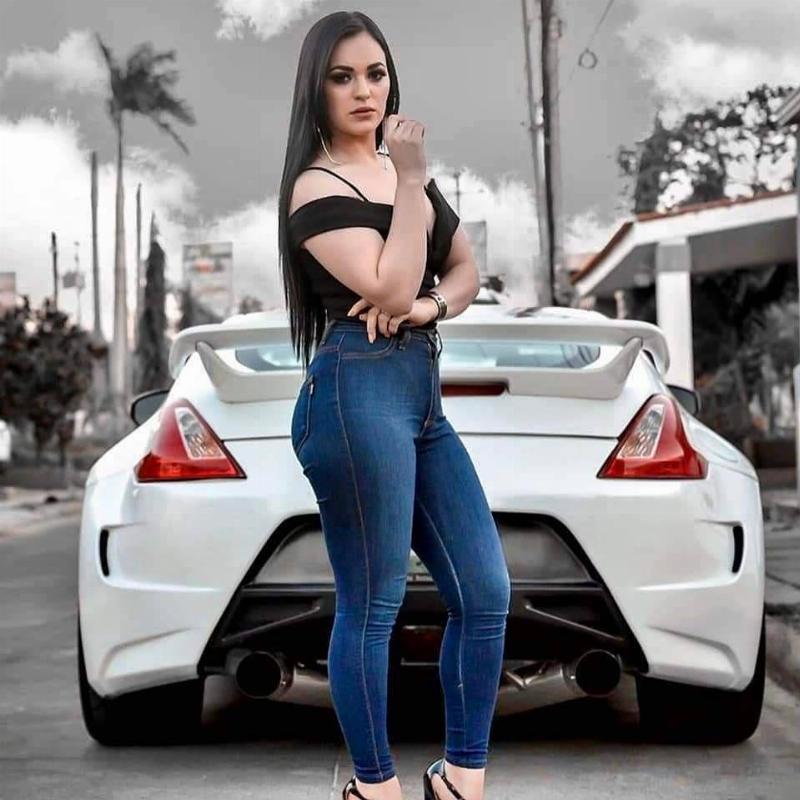 Woman in front of Nissan 370Z Nismo portrait shot