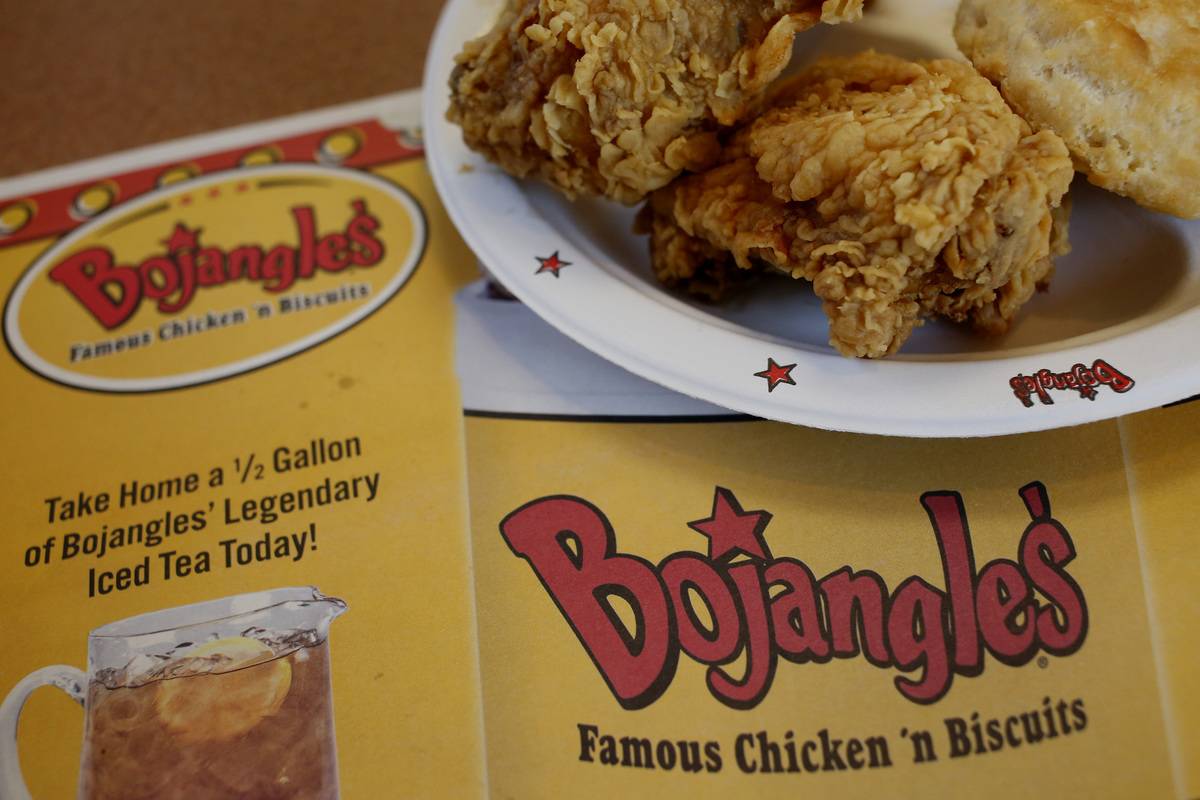Fried chicken is placed on a Bojangle's placemat.