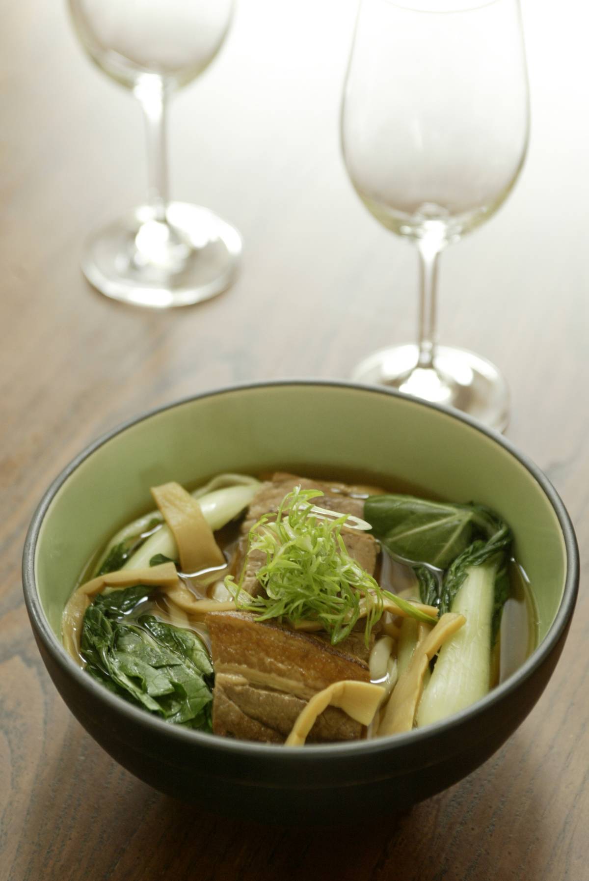 A bowl of udon noodles includes bamboo shoots.