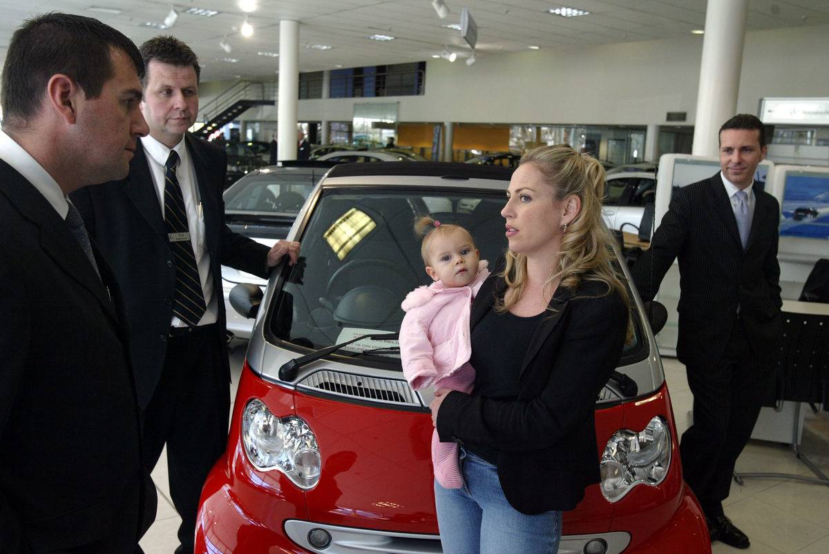 Juliet Potter speaks to car salesmen at Mercedez Benz in Zetland. Juliet was hir