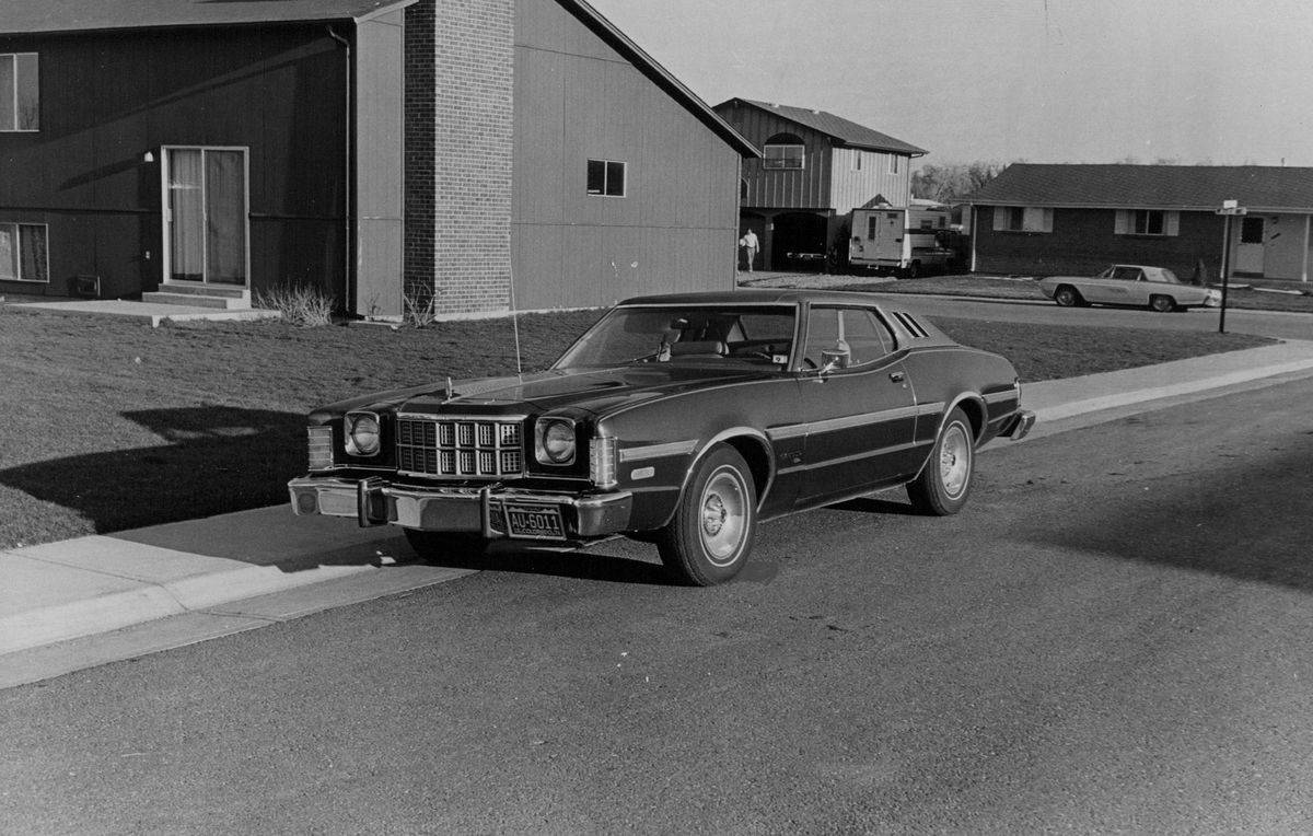 Ford Gran Torino Elite parked along a residential street