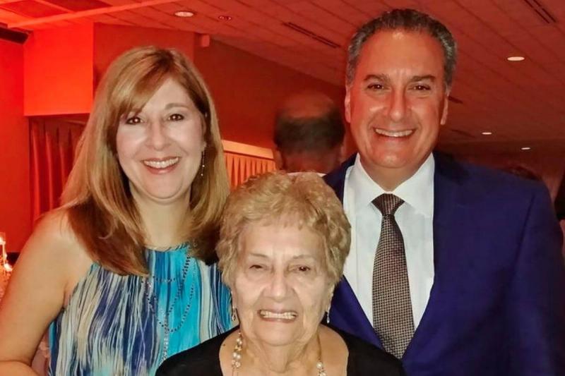 Joe and Jennifer Cartellone take a photo with one of their parents.