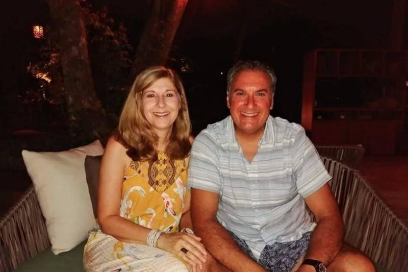 Joe Cartellone is photographed sitting next to his wife.