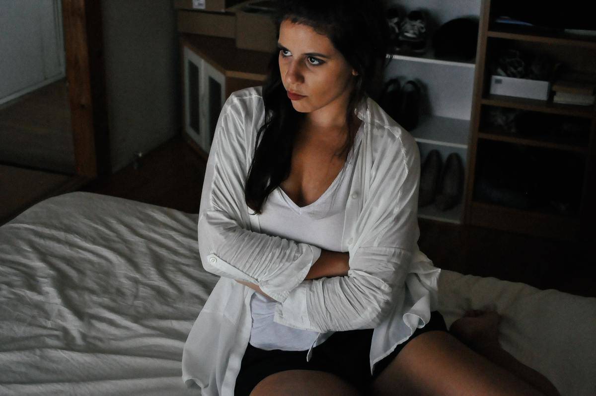 a girl crossing her arms