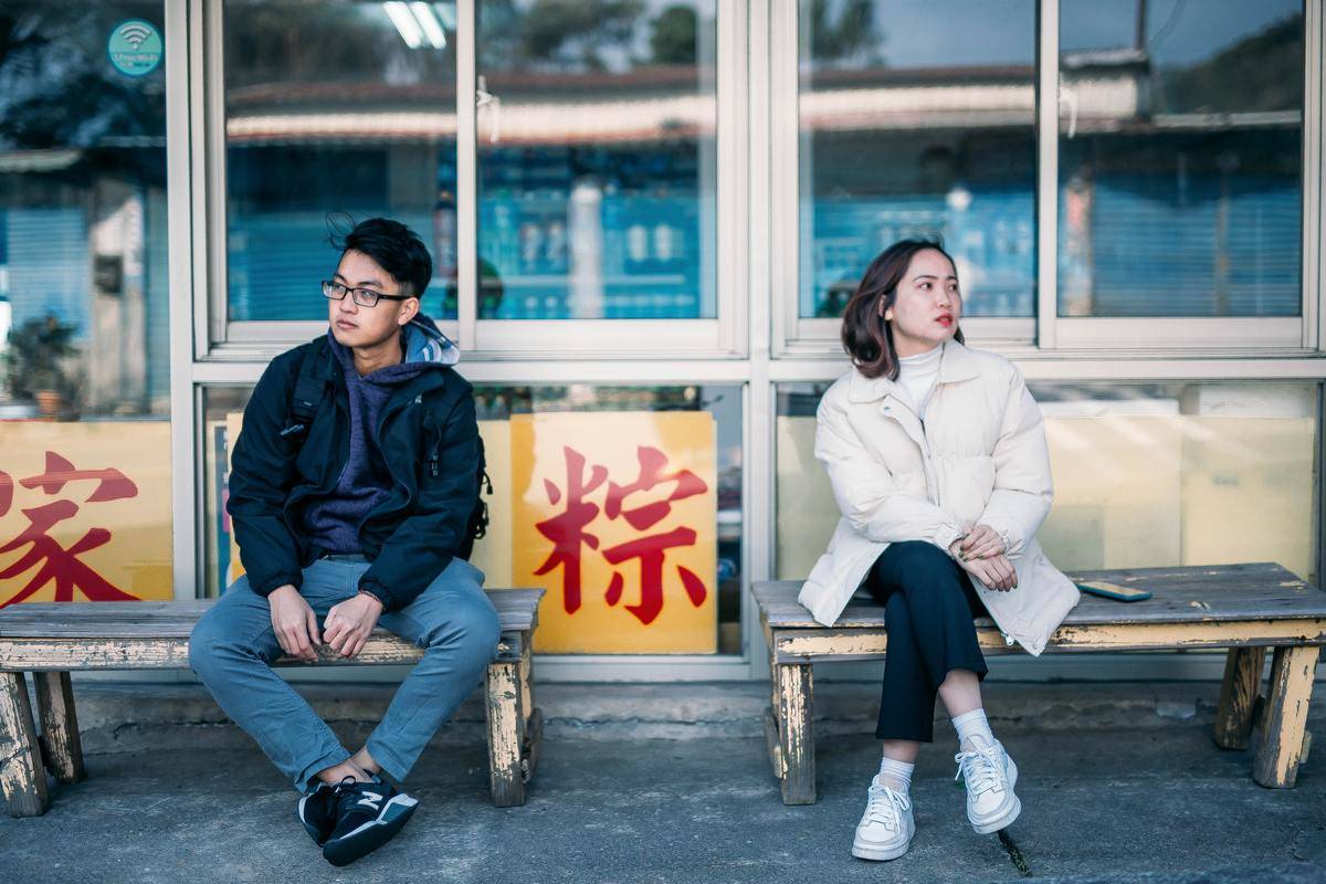 a girl folding her hands in her lap