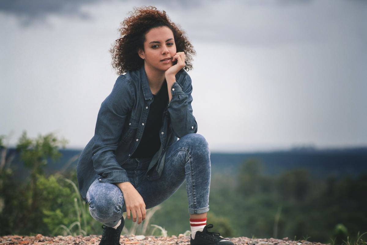 a woman kneeling on the ground