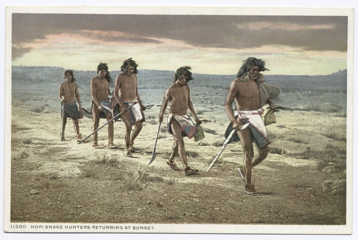 A line of ancient people travel to hunt.