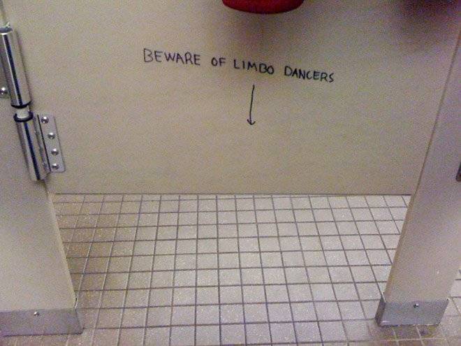 Public bathroom graffiti: beware of limbo dancers with an arrow pointing under stall door