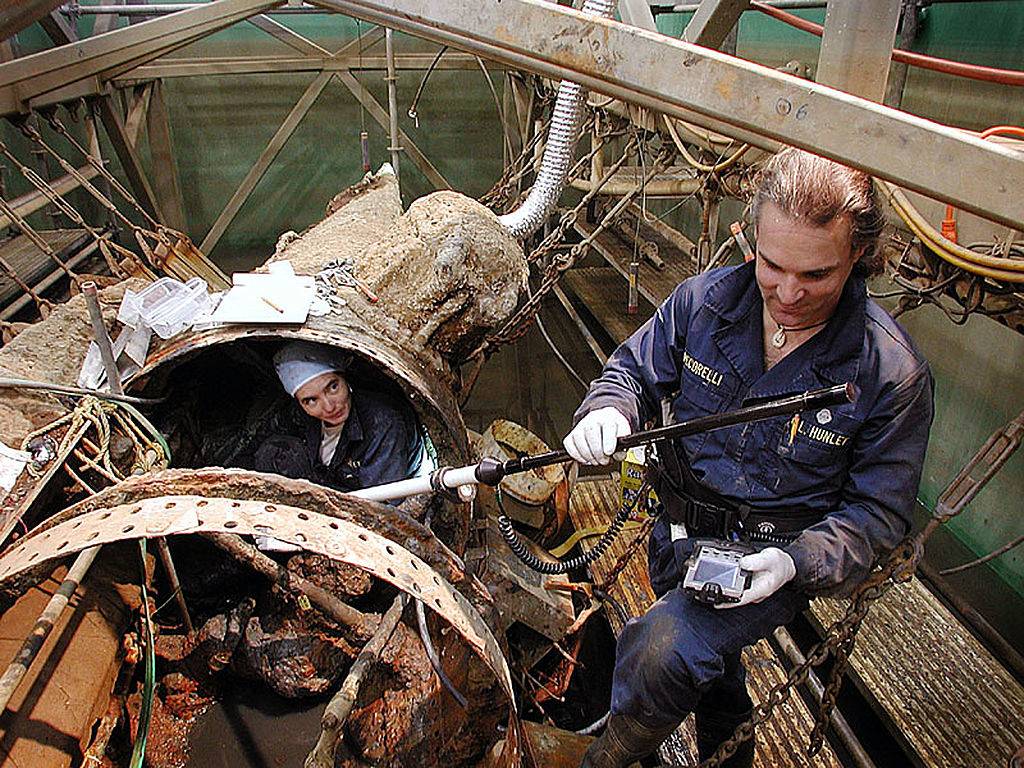 soldiers working on a submarine