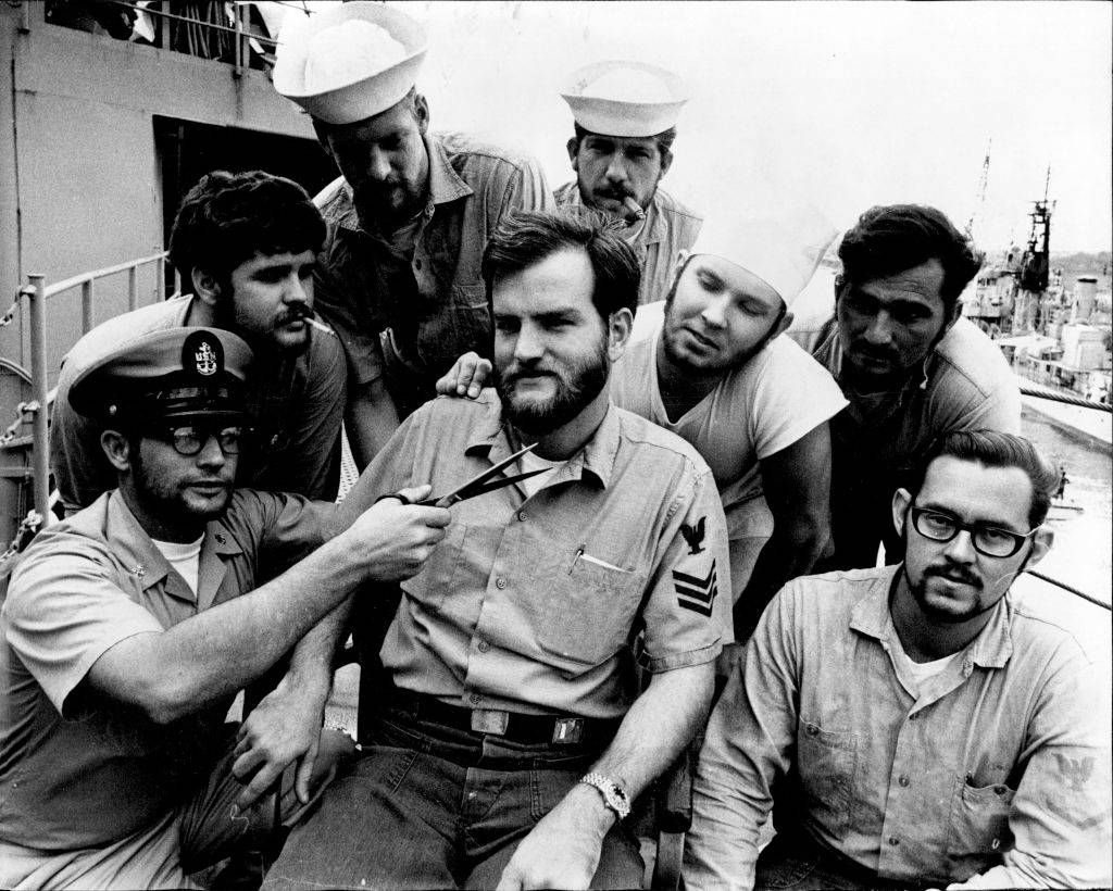 Some of the crew have their beards trimmed in anticipation of shore leave