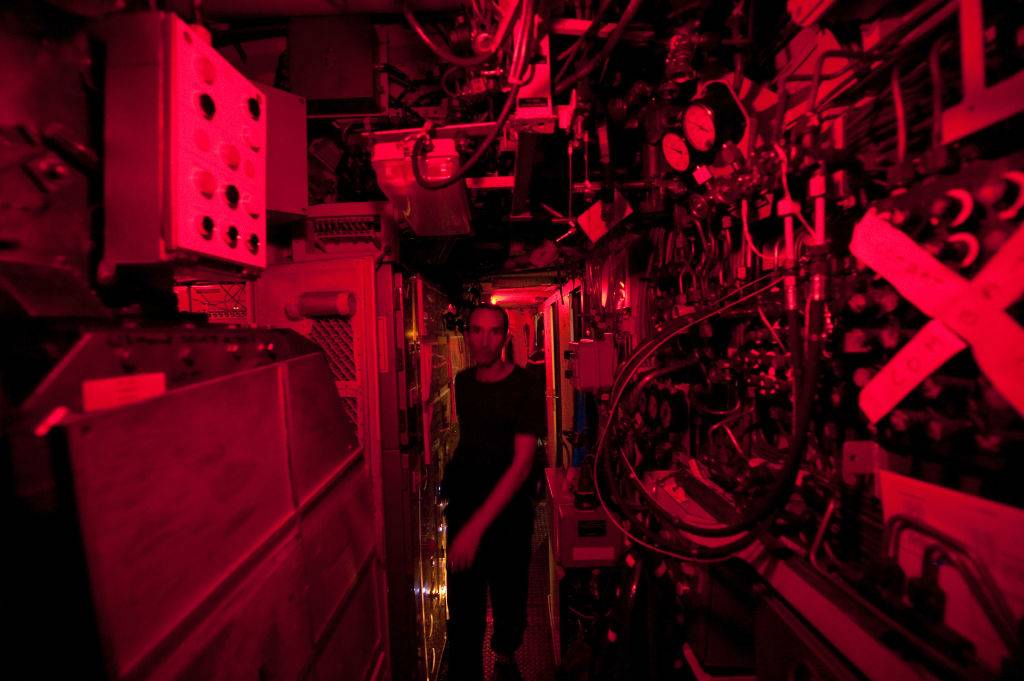 An officer walks in a corridor of French nuclear submarine