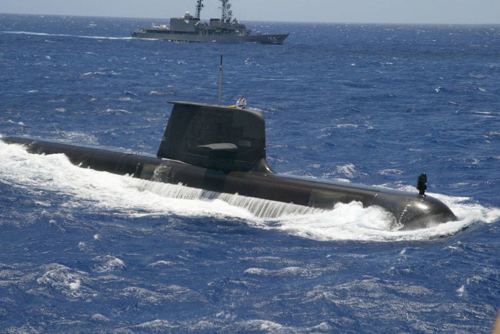 submarine partially submerged in the ocean