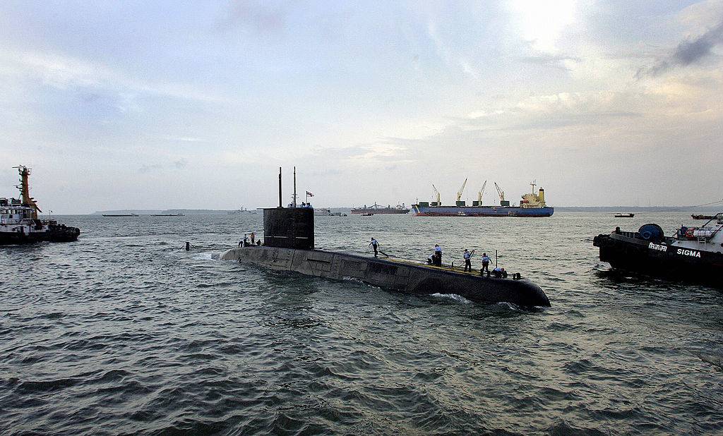 a submarine partially submerged in the water