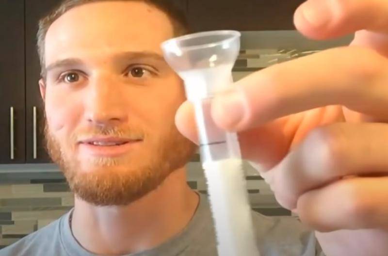 one of the bradys holding his spit for dna test