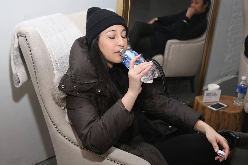 A New York Fashion Week attendee enjoys drinking from an Aquafina bottle on Day 5 of New York Fashion Week: The Shows at Skylight Clarkson Sq on February 15, 2016 in New York City