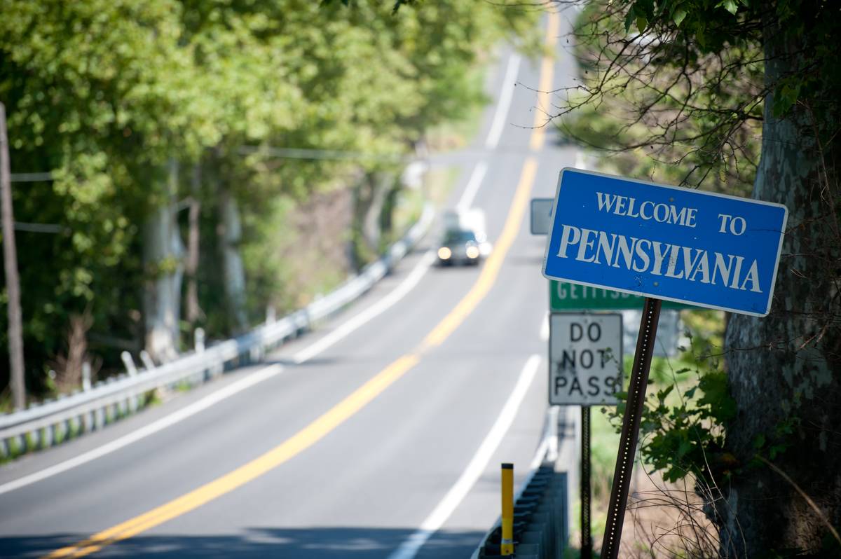 Mason Dixon Line signage alone side of the road entering Pennsylvania. 