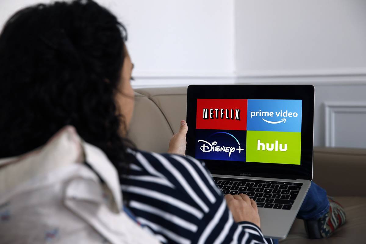 Logos of media service providers, Netflix, Amazon Prime Video, Disney + and Hulu are displayed on the screen of an Apple MacBook Pro on November 20, 
