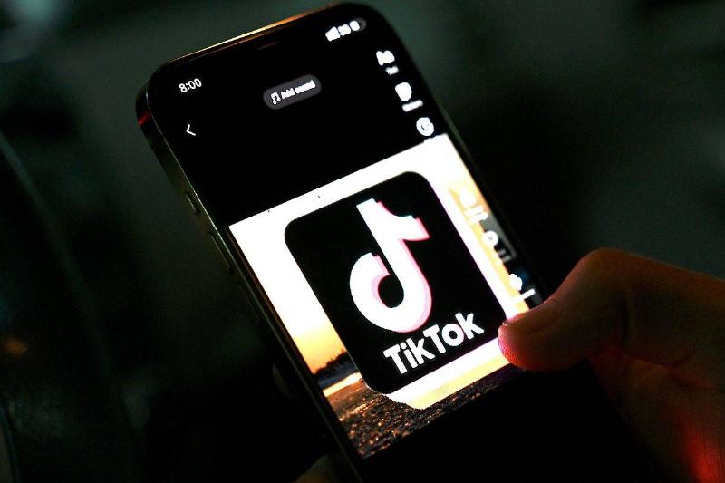 Person accessing TikTok on their cellphone