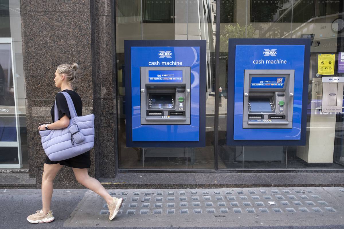 Halifax cash machines or ATMs on 14th July in London, United Kingdom. Halifax also known as The Halifax is a British banking brand operating as a trading division of Bank of Scotland. It is named after the town of Halifax.