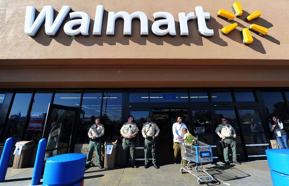 Police man the front of a Walmart store amid heightened security in Paramount, California on November 23, 2012 