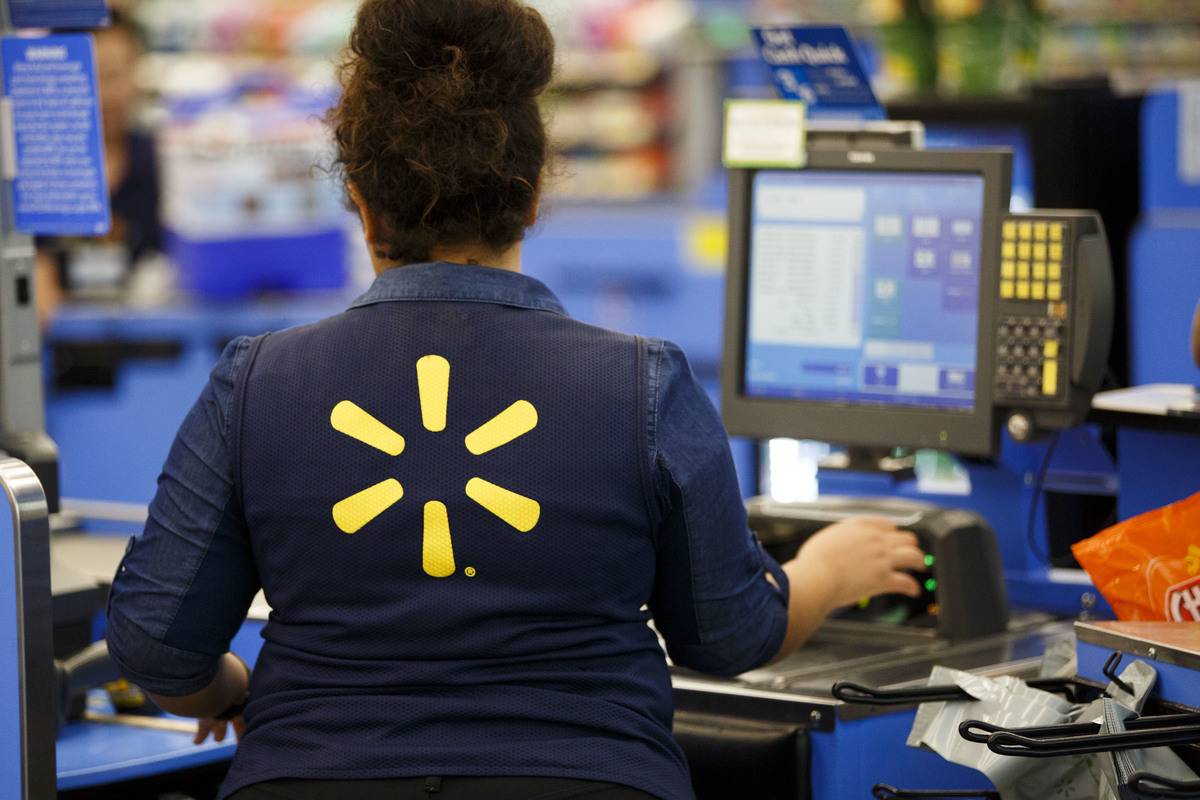 An employee scans items at a cash register at a Wal-Mart Stores Inc. location in Burbank, California, U.S., on Tuesday, Aug. 8, 2017. Wal-Mart Stores is scheduled to release earnings figures on August 17.