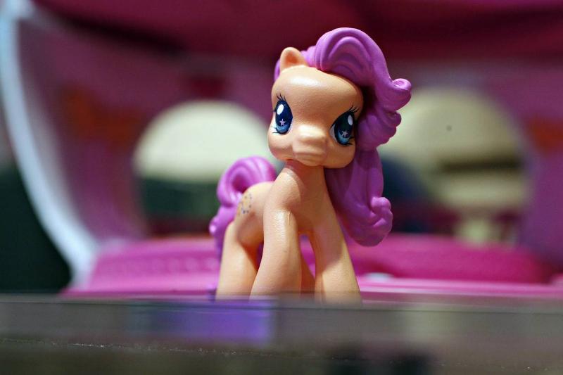 A My Little Pony Ponyville character sits on display in the