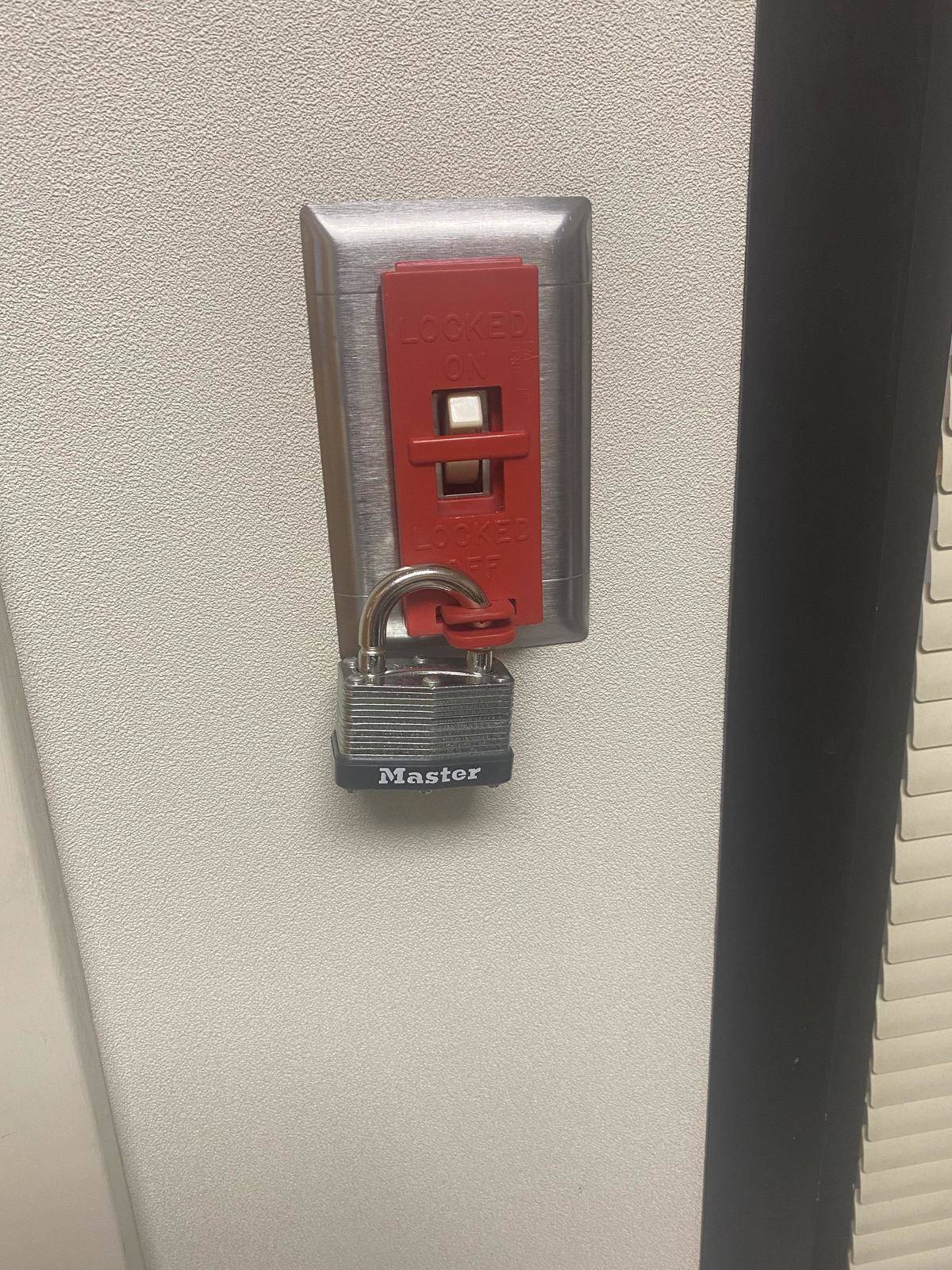 Padlock over light switch