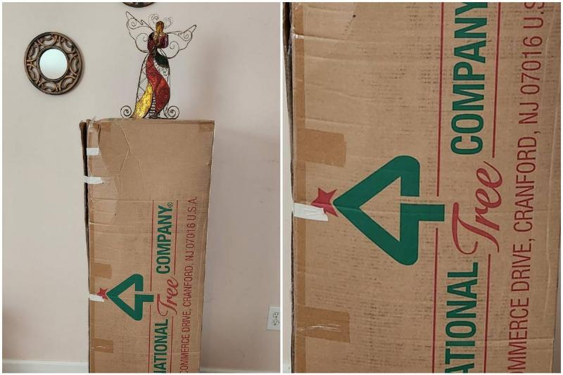 Cardboard box with angel figurine standing on top