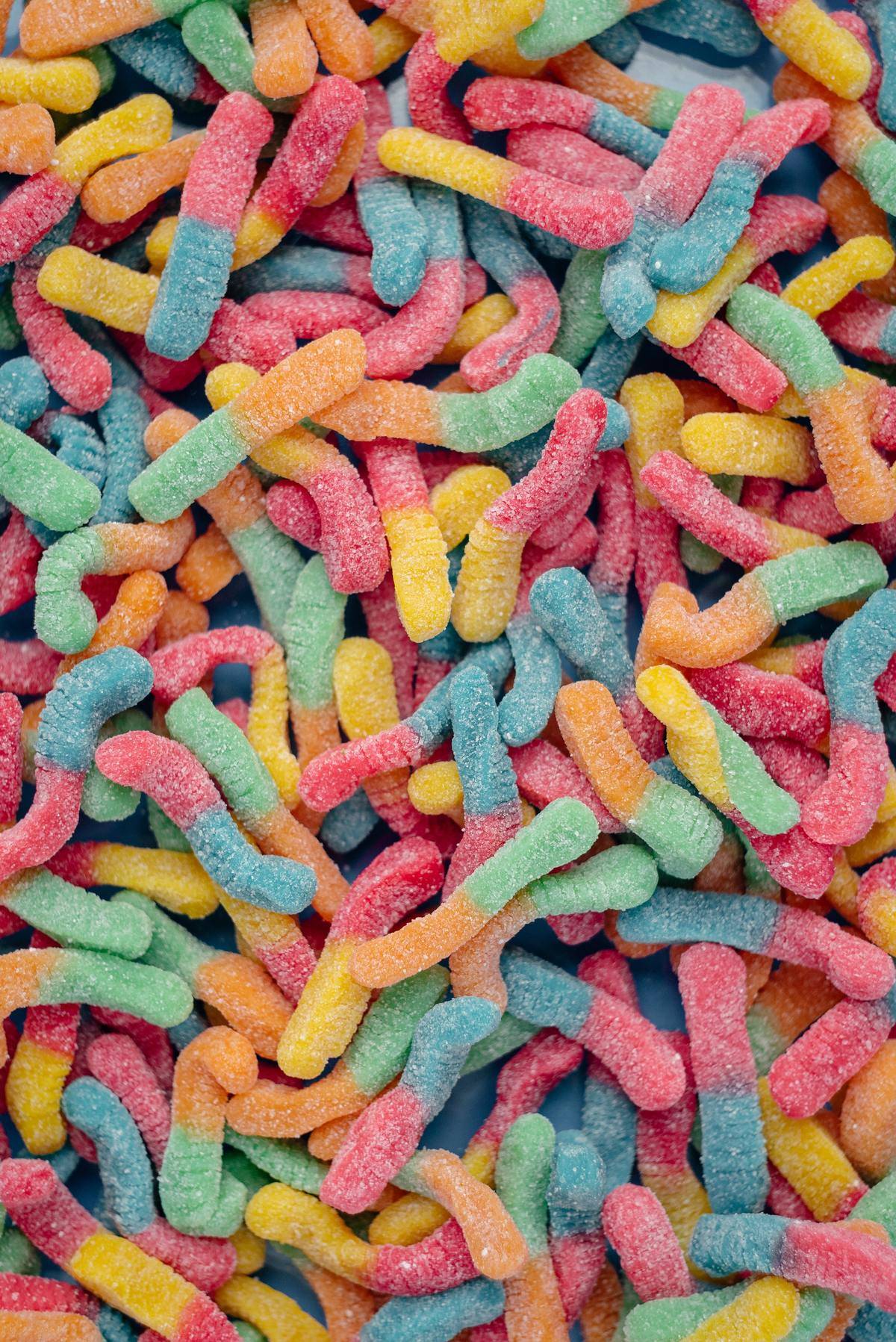 sour gummy worms in bright colors