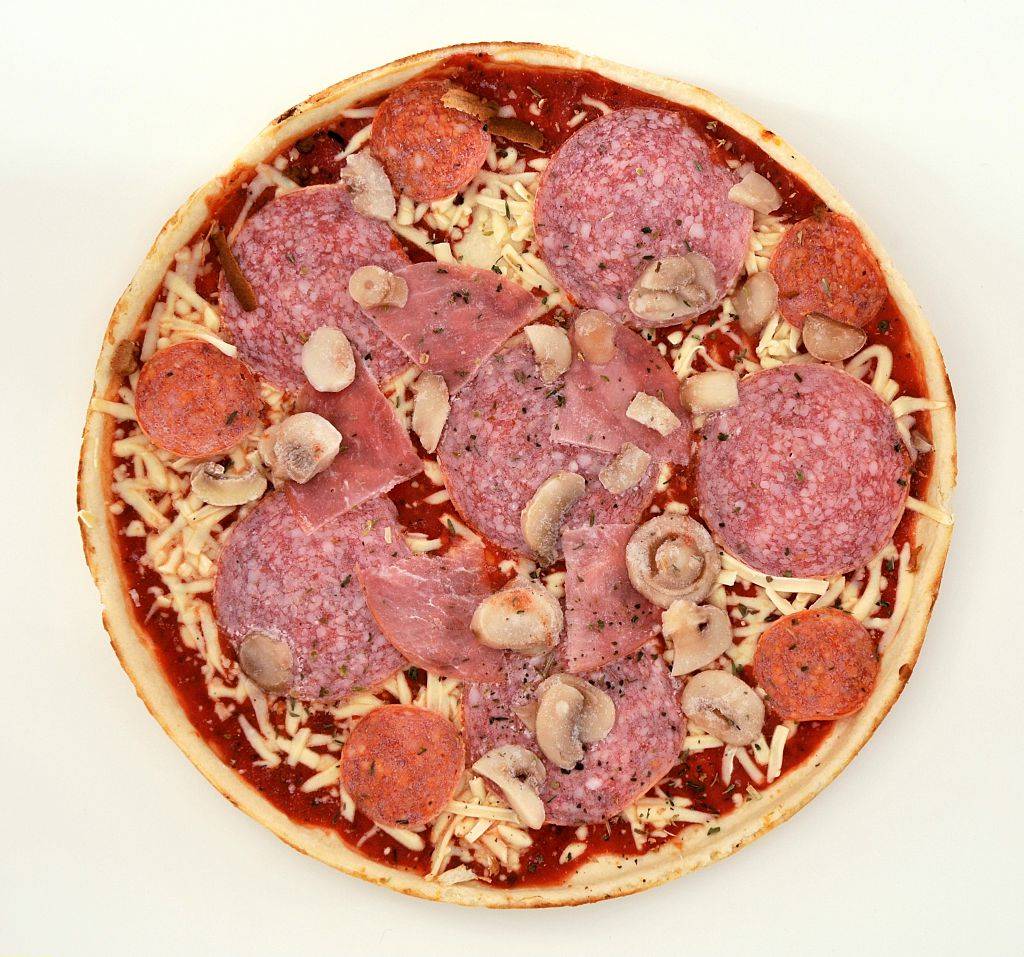 frozen pizza with pepperoni, mushrooms, and salami
