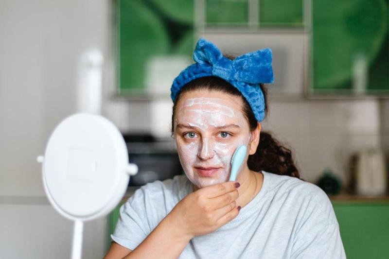 woman-massaging-face-skin-with-moisturizing-mask-w-2022-11-18-00-25-22-utc