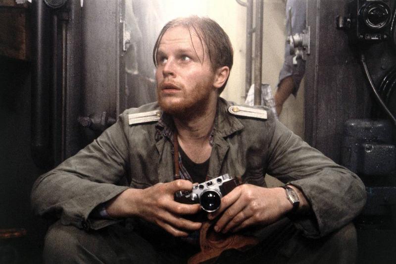 naval officer holding camera in Das Boot