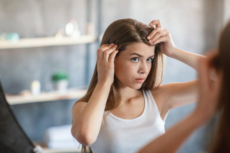 pretty-girl-with-hair-loss-problem-looking-in-mirr-2022-12-16-06-45-22-utc