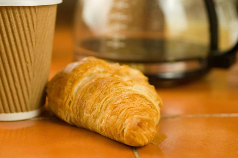 selective-focus-shot-of-a-croissant-with-takeaway-2023-02-04-04-31-45-utc