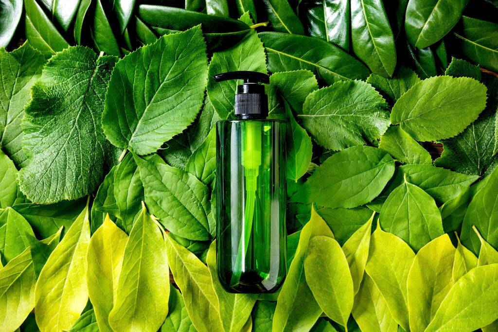 Empty green plastic bottle for soap