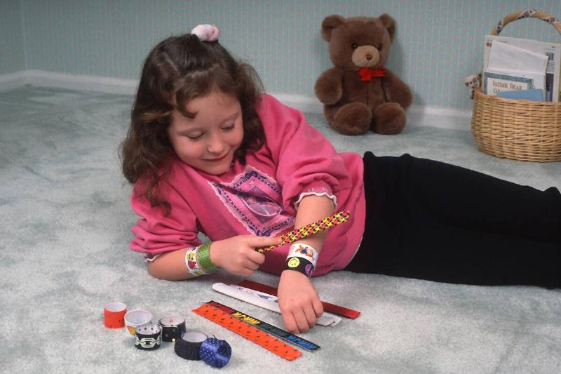 A little girl plays with her 