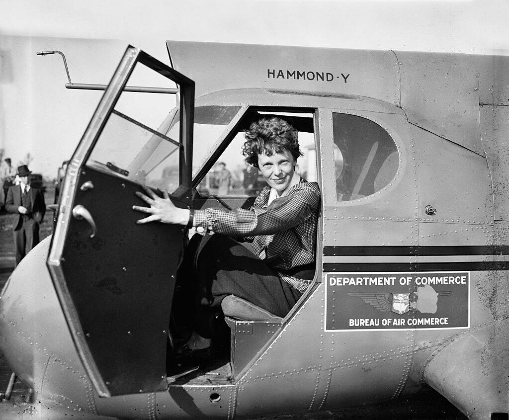 Amelia Earhart, Portrait Sitting in Airplane